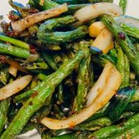 Xo String Beans · String beans stir fried with a house-made spicy seafood sauce.