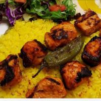 Chicken Souvlaki (Shish Tawook) · Grilled marinated chicken breast served with rice and 2 sides.