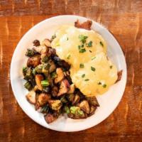 Benny Hill · Poached eggs, bacon, & chipotle hollandaise on biscuit, breakfast potatoes, okra.