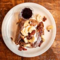 Brioche Frenchy · Candied bacon-peanut butter, banana, maple syrup, powdered sugar, creme.