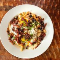 Papa'S Poutine · Fries, cheese curds, bacon & eggs, southern gravy.