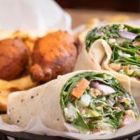Oink-Less Wrap · Feta cheese, red onion, spinach, tomato, cucumber & pepperoncini in a flour tortilla w/ basi...