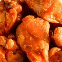 Buffalo Wings · Bone-in chicken wings fried until crispy and golden, tossed in buffalo sauce. Served with a ...
