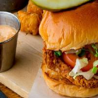 Crispy Chicken Sandwich · Golden crispy fried chicken fillet, on a griddled buttered bun with cheese lettuce, tomato, ...