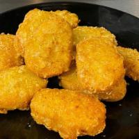 Chicken Nuggets · 10 count. All white meat chicken nuggets fried until golden.