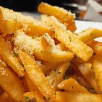 Garlic Parmesan Fries · Fried until crispy and golden, tossed in a garlic parmesan seasoning. Served with a side of ...