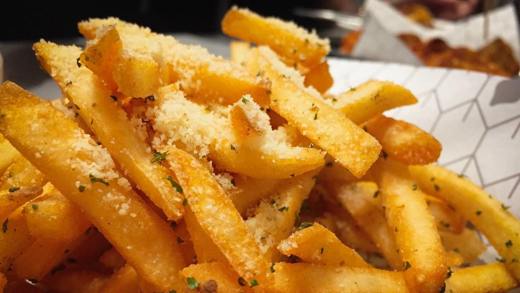 Garlic Parmesan Fries · Fried until crispy and golden, tossed in a garlic parmesan seasoning. Served with a side of our house-made garlic parmesan aioli. Vegetarian.