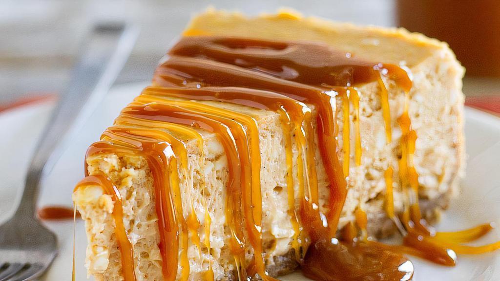 Dulce De Leche Cheesecake · Smooth, creamy perfection on a sinful graham cracker crust and topped with a luscious dulce de leche sauce.