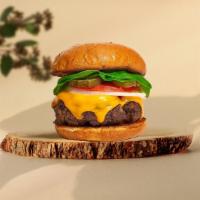 Melt Me Halfway Burger  · Seasoned plant-based patty topped with melted vegan cheese, lettuce, tomato, onion, and pick...
