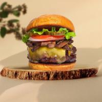 Funghi Feast Burger  · Seasoned plant-based patty topped with mushrooms, melted vegan cheese, lettuce, tomato, onio...