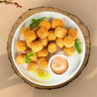 Golden Tots · Shredded Idaho potatoes formed into tots, battered, and fried until golden brown.