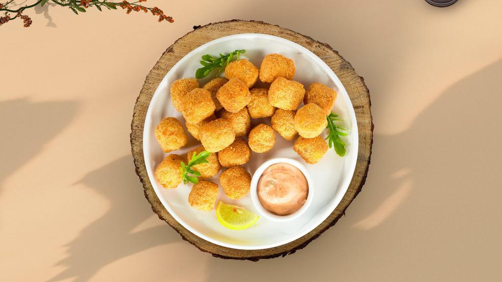 Golden Tots · Shredded Idaho potatoes formed into tots, battered, and fried until golden brown.