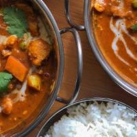 House Curry · Sweet potatoes, chickpeas, carrots, and celery simmered in a rich coconut curry with toasted...