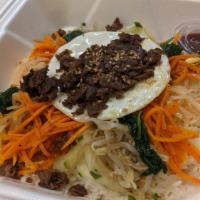 Bibimbap · Mixed rice comes with white sticky rice and assorted vegetables topped with fried egg and be...