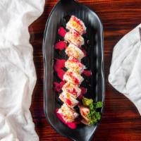 Berry Roll · Spicy tuna, cream cheese, and avocado topped with crab meat, sweet lemon sauce and berry sau...