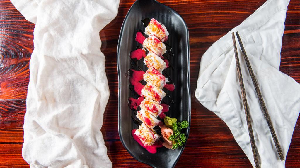 Berry Roll · Spicy tuna, cream cheese, and avocado topped with crab meat, sweet lemon sauce and berry sauce made with raspberry, blueberry, and blackberry.