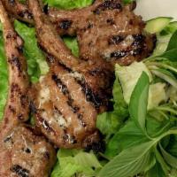 Dê Nướng Xả · Grill marinated lamb chops with lemongrass served with lettuce topped with special fish sauc...