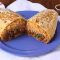 Burrito · Rice, beans, cheese, onions, cilantro, and choice of meat in a flour tortilla