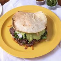 Vampiro · Two crunchy tortillas with melted cheese onion cilantro and your choice of meat