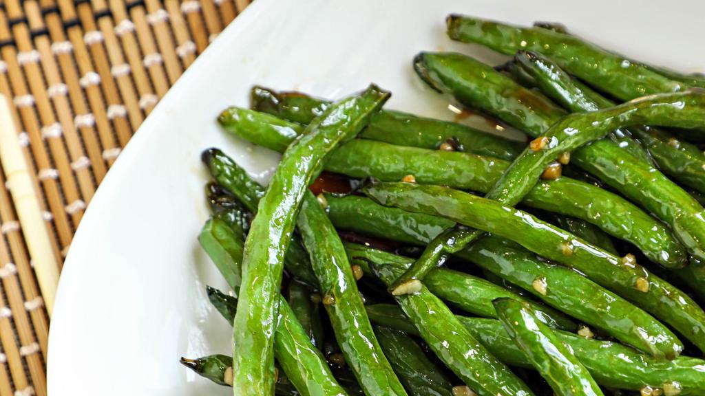 Green Beans · Freshly picked green beans pan seared in our delicious sauce.