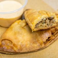 Meat Hand Pies · A flaky pie crust stuffed with your choice of meat filling. Deep fried or baked. Served with...