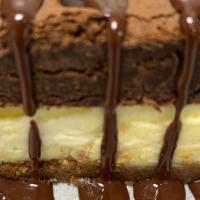 Rafael'S Fat Boy Sundae · A triple cream cheesecake topped with a chocolate brownie and drizzled with rich chocolate s...