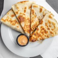 Grilled Chicken And Roasted Veggies Quesadilla · Grilled seitan and veggies amongst melty cheese in a crispy tortilla served with a side of o...