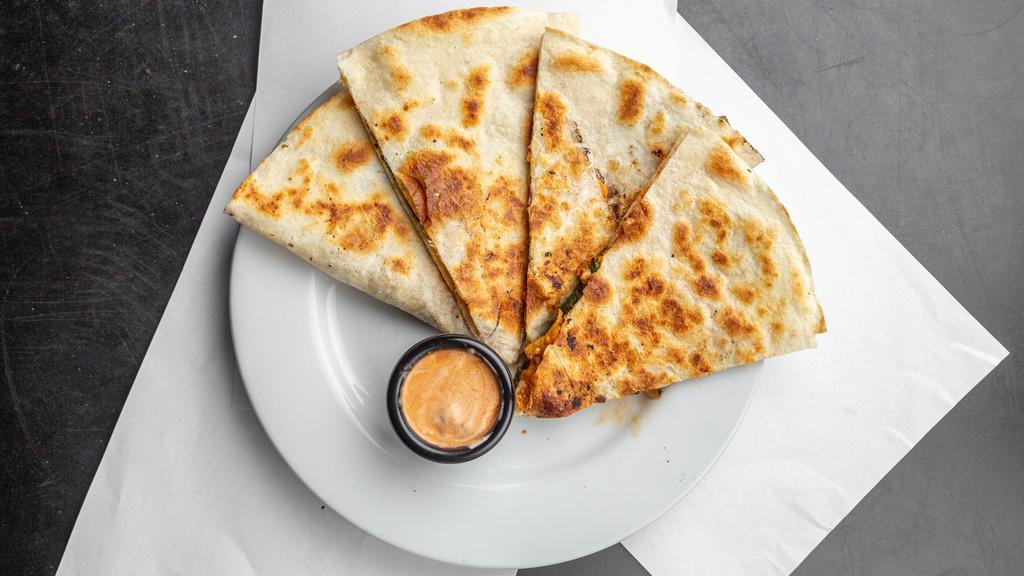 Grilled Chicken And Roasted Veggies Quesadilla · Grilled seitan and veggies amongst melty cheese in a crispy tortilla served with a side of our chipolte ranch sauce.