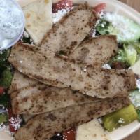 Lamb & Beef Gyros Salad · Lamb and beef gyros served with Greek salad, kalamata olives, Feta cheese, bread, and tzatzi...