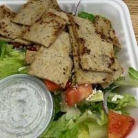 Chicken Gyros Salad · Chicken gyros served with Greek salad, kalamata olives, Feta cheese, bread, and tzatziki sau...