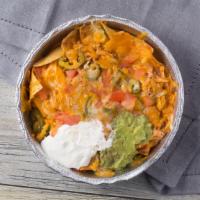 Super Nachos · Beef or chicken with bean, jalapenos, tomato, onions, cheese,sour cream and guacamole.