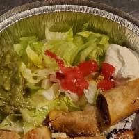 Taquitos Rancheros Appetizer · Rolled four or corn tortillas filled with chicken or picadillo then deep fried. Topped with ...