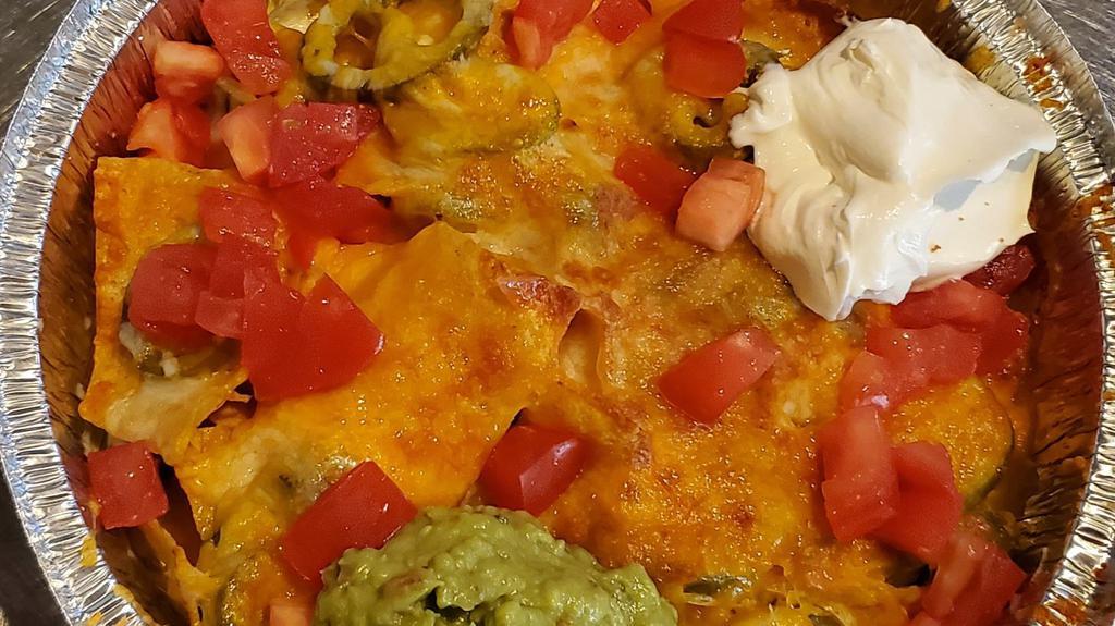Nachos Deluxe · With jalapeno , cheese, tomatoes, sour cream and guacamole.