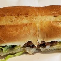 Torta Regular · Lettuce, onion, jalapeno, beans, avocado and tomato. Made with bread, Mexican style with a c...