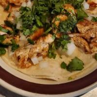 Chicken Mexican Taco · Made with a soft corn tortilla filled with grilled  chicken, cilantro and onion.