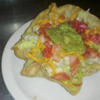 Taco Salad · Ground beef or chicken served in a deep fried flour tortilla bowl, topped with lettuce, chee...