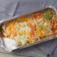Burrito Supreme · Flour tortillas filled with your choice of chicken , rice and beans or ground beef, rice and...