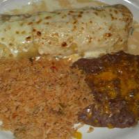 Spinach Enchiladas · Rolled corn tortilla filled with spinach, tomato and onions. Topped with a cream sauce and m...
