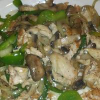 Arroz Con Pollo · A mixture of boneless chicken, onion, green peppers and mushrooms served on a bed of Spanish...