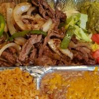 Carnitas · Choice of sirloin strips or boneless chicken, fried tender with green pepper and onion. Guac...