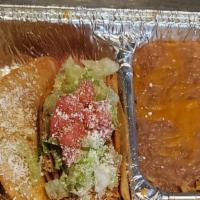 Tacos Dorados · Two crisp corn tortillas filled with mash potatoes and choice of shredded beef or chicken to...