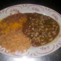 Chile Verde · Cubed pork simmered in a delicious green sauce made with onions, bell pepper and spices. Ser...