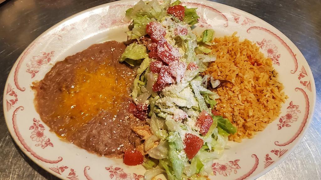 Sopitos · Three house made thick corn tortillas with your choice of chicken or beef, served open faced, topped with refried beans, lettuce,  cotija cheese and tomato, rice and beans.