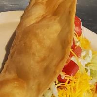 Chalupa · Folded flour tortilla, deep fried, filled with beef or shredded chicken, lettuce, cheese and...