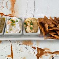 Dip Sampler · Our power sampler, includes your favorite hummus, baba ghanouj, labneh and pita chips!