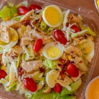Cobb Salad · Grilled chicken with Romaine lettuce, tomatoes, boiled egg, bacon, corn & Jack & Cheddar che...