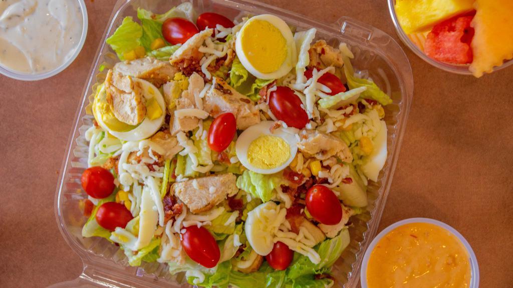 Cobb Salad · Grilled chicken with Romaine lettuce, tomatoes, boiled egg, bacon, corn & Jack & Cheddar cheese.