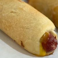 Bagel Dogs · A 1/4 pound jumbo beef  hot dog with cheddar cheese wrapped in our delicious bagel dough.