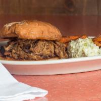 Pulled Pork Sandwich · Straight from our Hickory smoker- A hefty portion of slow cooked pork shoulder mixed with ou...