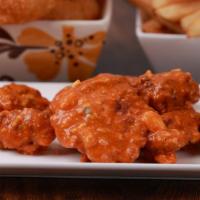 Boneless Wings - 6 Pieces · (6) Large all white meat Boneless Wings, lightly battered and flash fried.  All the fun with...